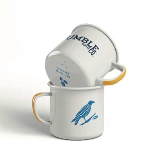 Two white mugs with blue text and graphics on a white background